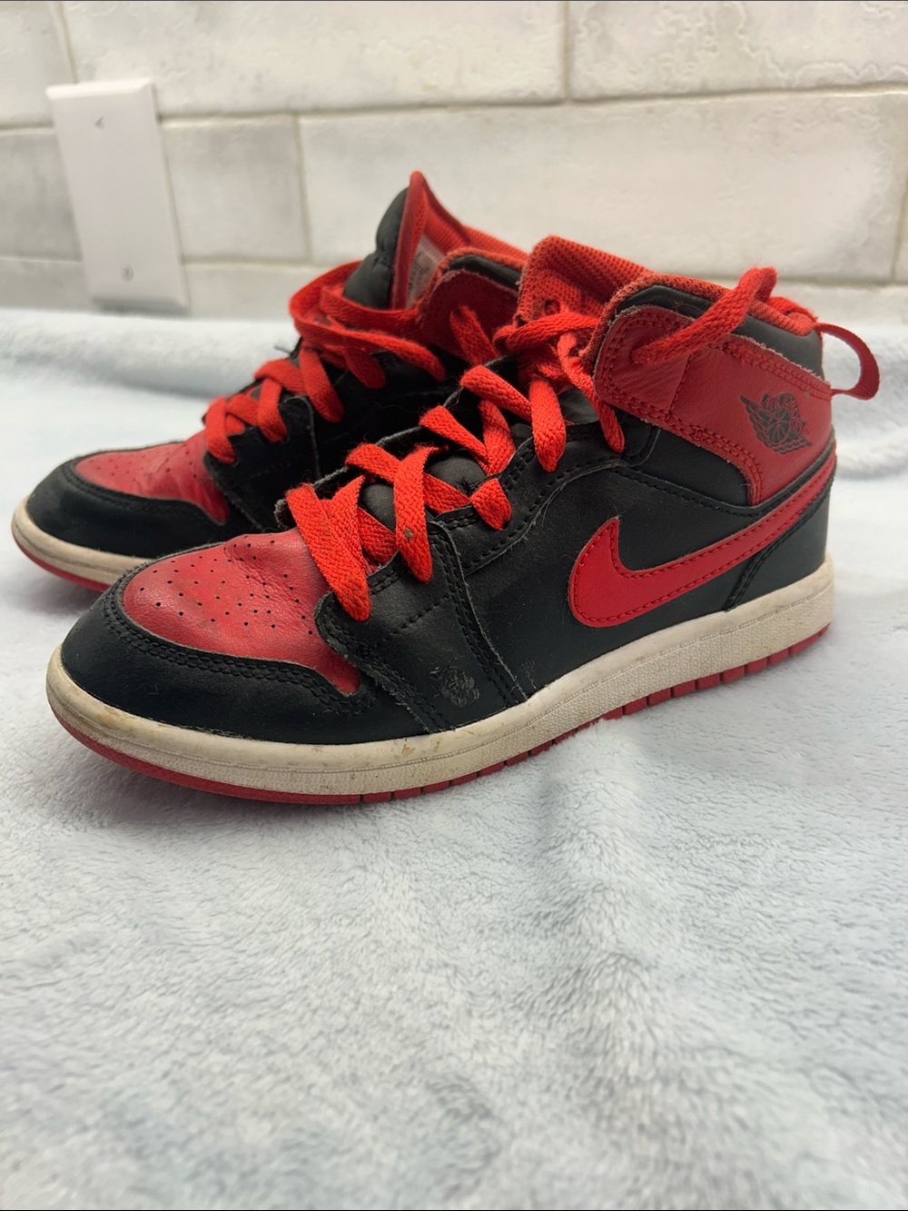 Nike Kids Black and Red Air Jordans High-Top Sneakers